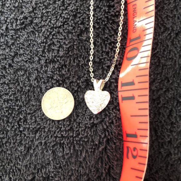 Heart bling dime size w/solid back with slight rub marks on back. Silver color. - Picture 6 of 15